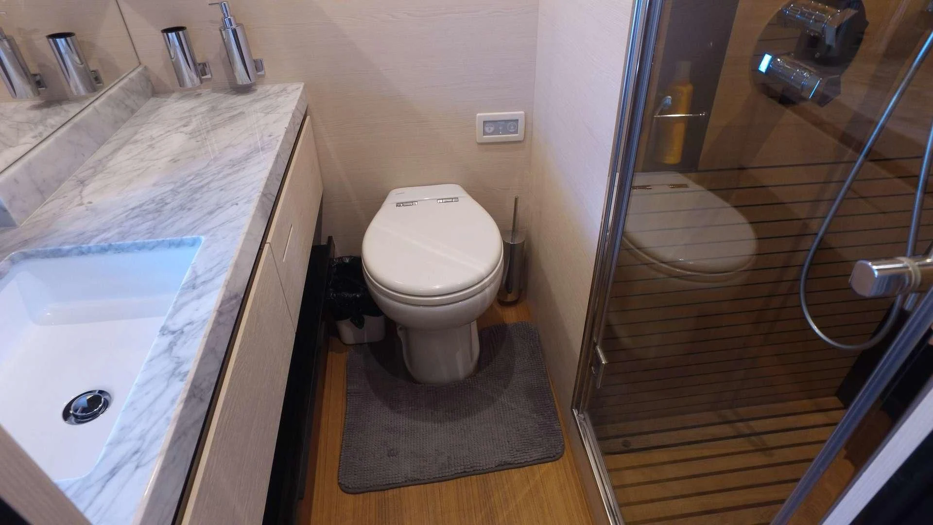 a bathroom with a glass shower aboard SOLACE NT Yacht for Sale
