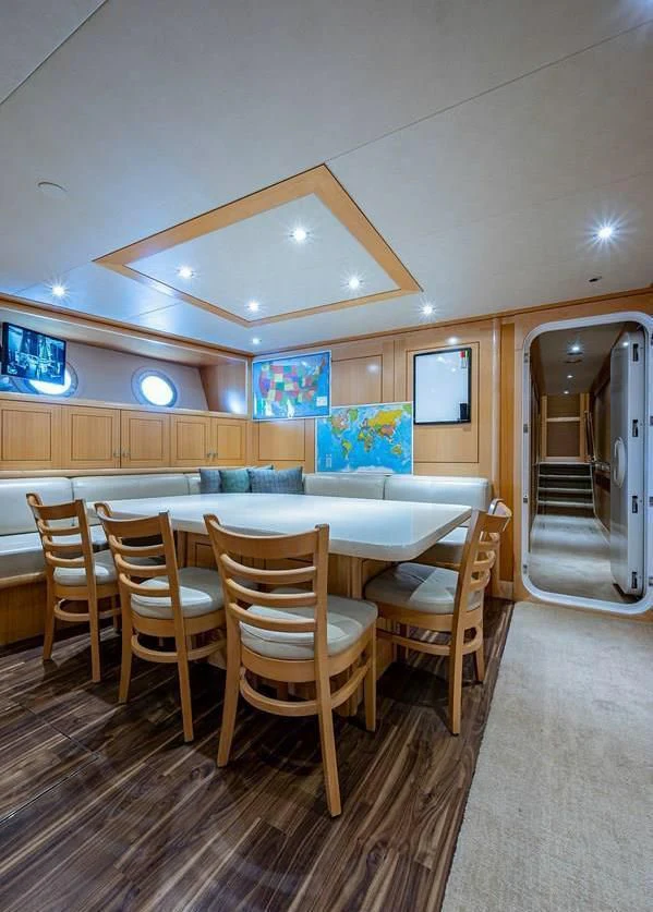 a kitchen with a dining table aboard NIGHT HOWL Yacht for Sale