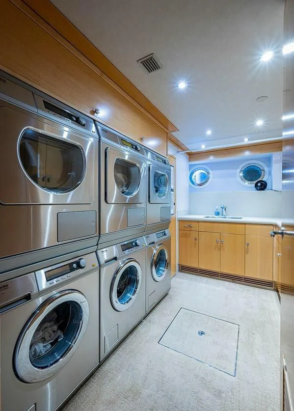 a large laundry room with washer and dryer aboard NIGHT HOWL Yacht for Sale