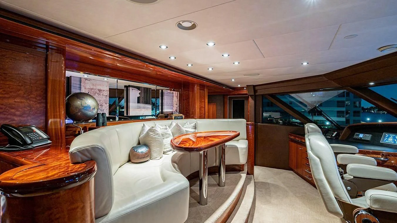 a room with a couch and a table and a television aboard NIGHT HOWL Yacht for Sale