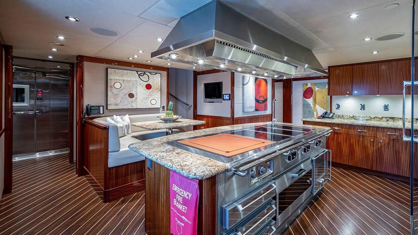 a kitchen with a large island aboard NIGHT HOWL Yacht for Sale