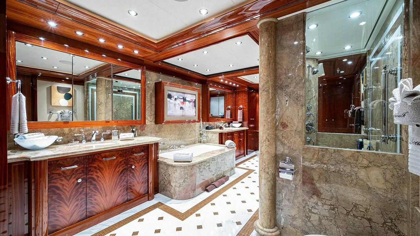 a bathroom with a marble countertop aboard NIGHT HOWL Yacht for Sale