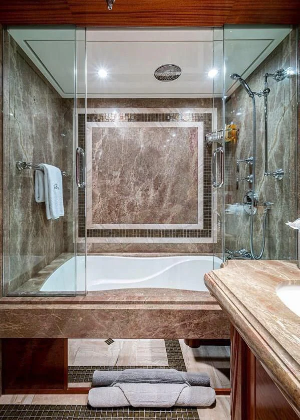 a bathroom with a large bathtub aboard NIGHT HOWL Yacht for Sale