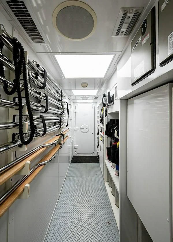 a hallway with white doors aboard NIGHT HOWL Yacht for Sale
