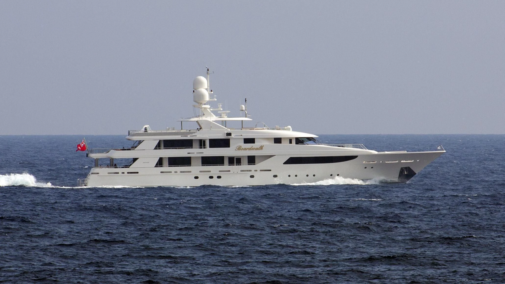 a large white ship in the water aboard NIGHT HOWL Yacht for Sale