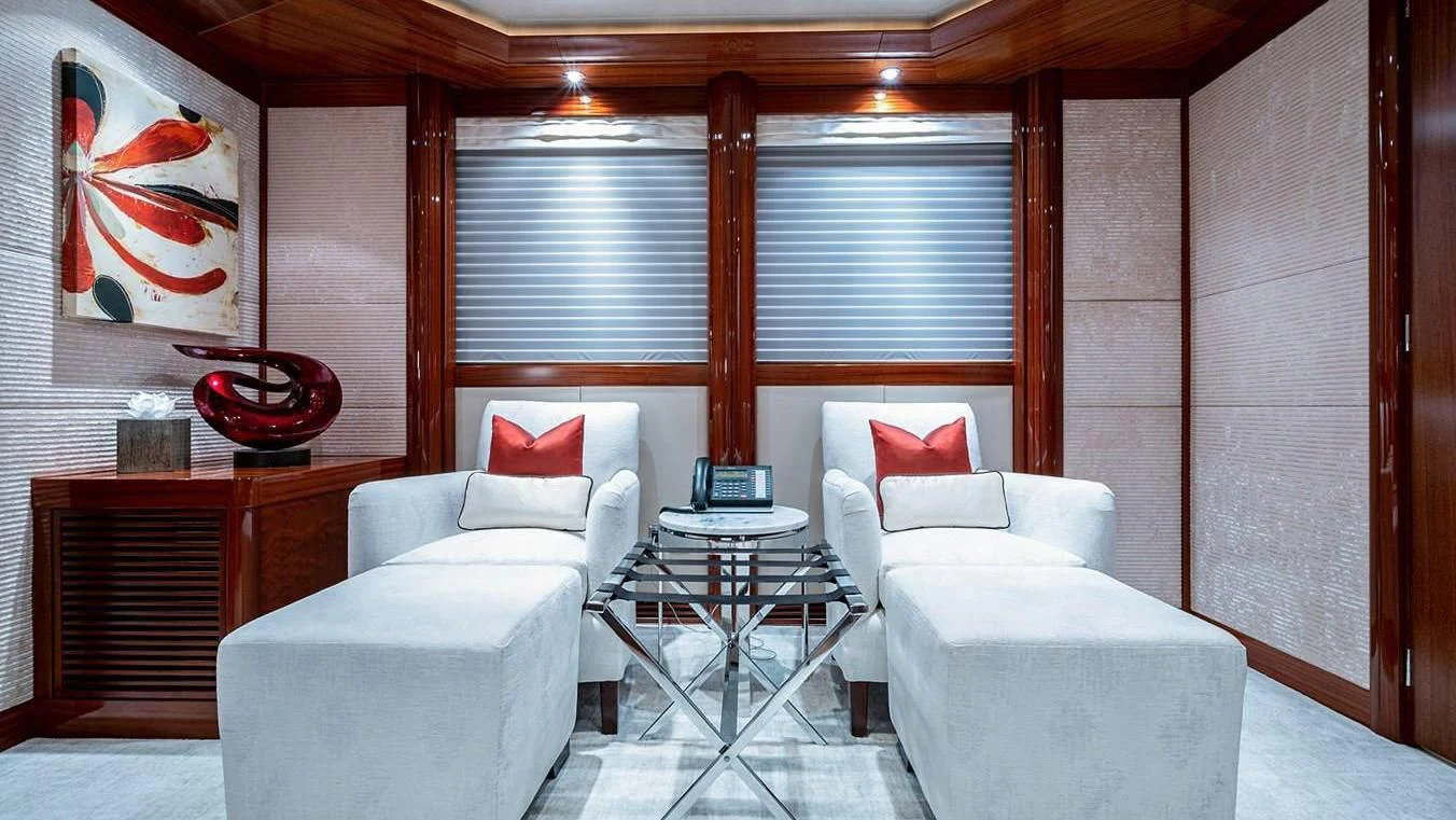 a room with a couch and a table and a television aboard NIGHT HOWL Yacht for Sale