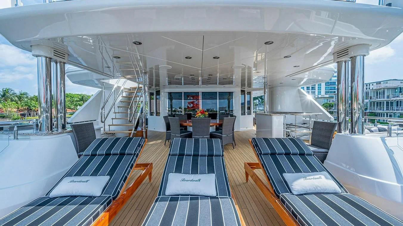 inside of a building with a large glass wall and a large open area with a black and white aboard NIGHT HOWL Yacht for Sale