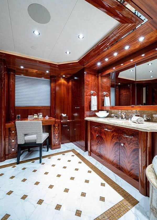 a bathroom with a sink and a mirror aboard NIGHT HOWL Yacht for Sale