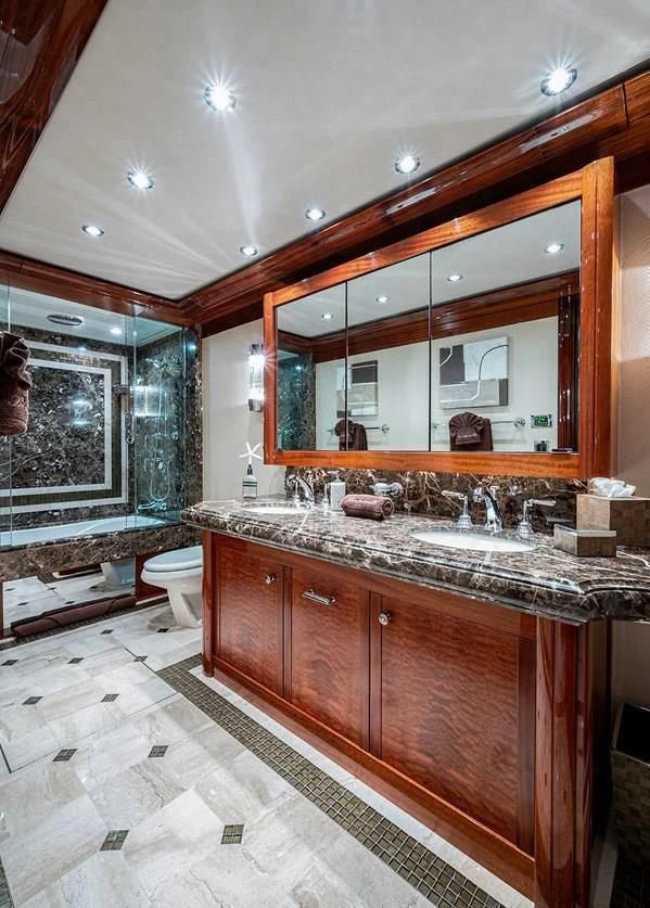 a bathroom with a large mirror aboard NIGHT HOWL Yacht for Sale