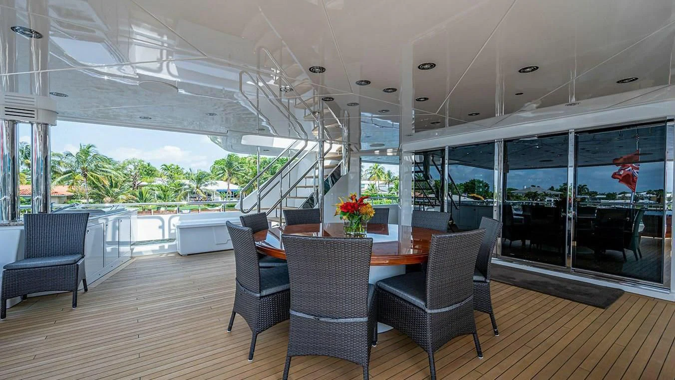 a large room with a table chairs and a large window aboard NIGHT HOWL Yacht for Sale