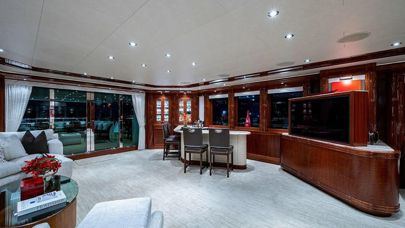 a living room with a large tv aboard NIGHT HOWL Yacht for Sale