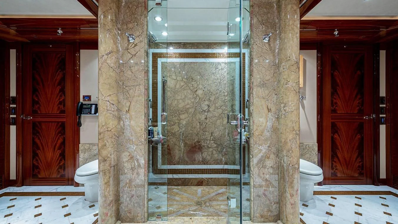 a bathroom with a glass shower aboard NIGHT HOWL Yacht for Sale