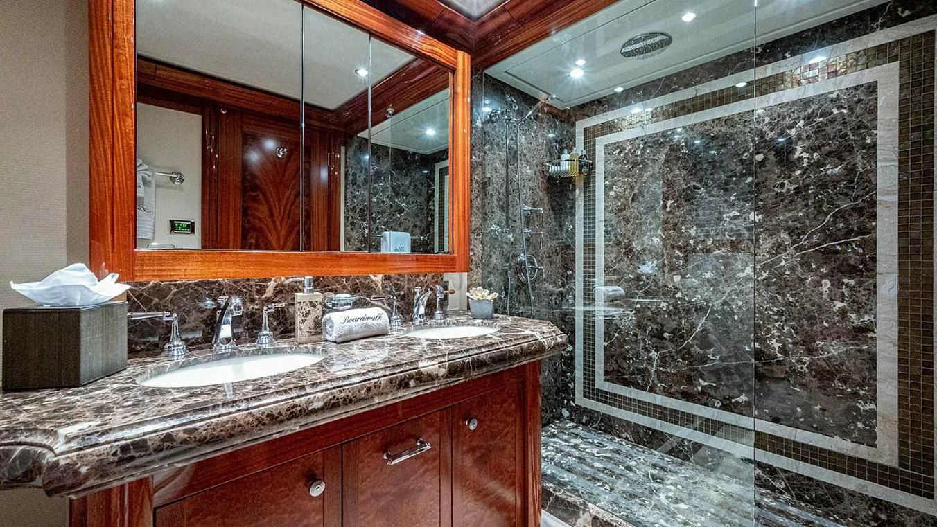 a bathroom with a large mirror aboard NIGHT HOWL Yacht for Sale