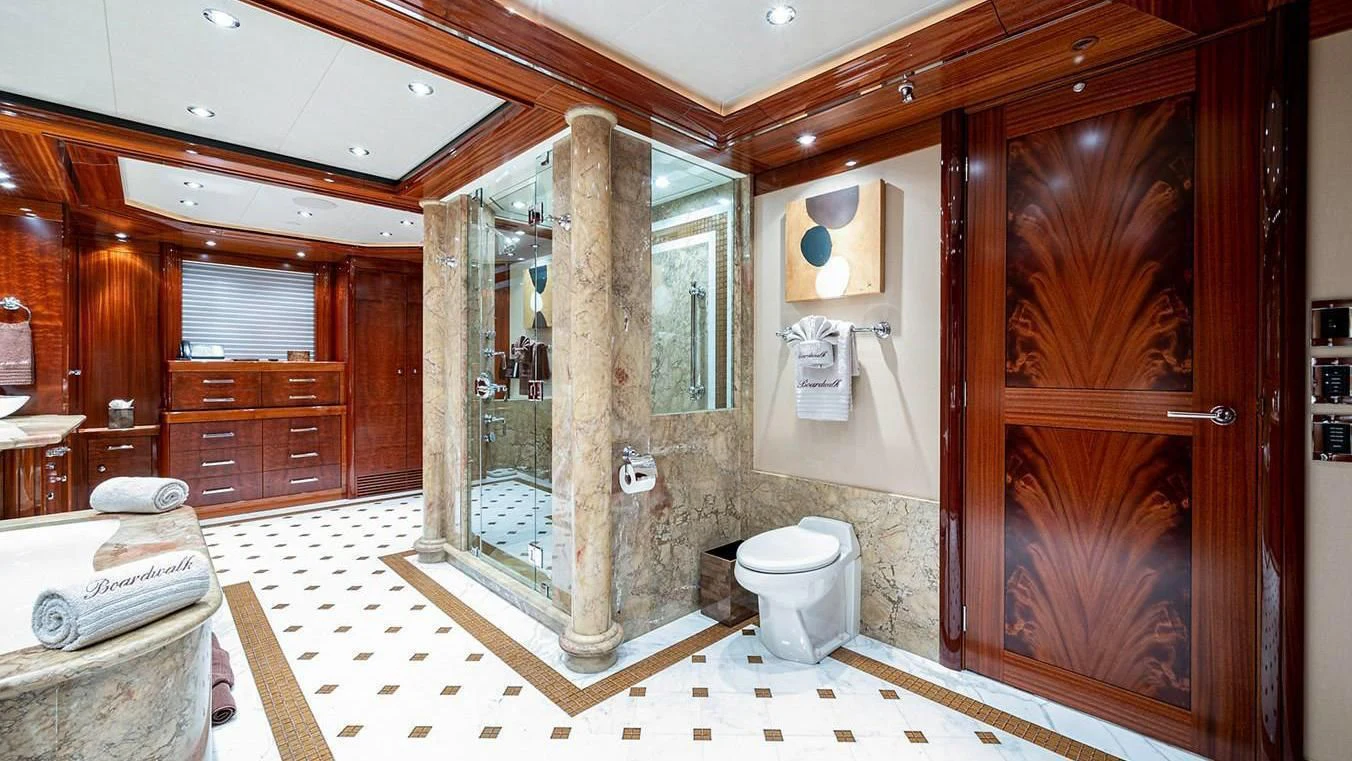 a bathroom with a glass shower aboard NIGHT HOWL Yacht for Sale