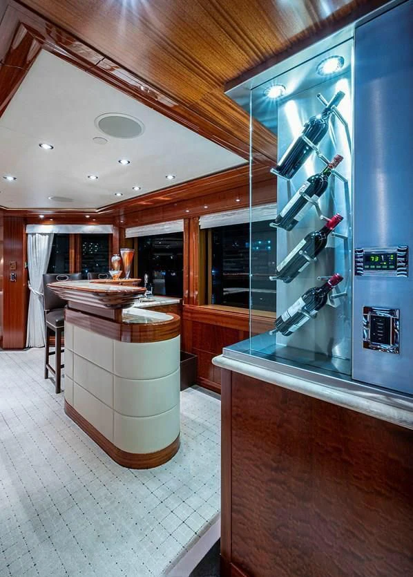 a large kitchen with a large glass display case aboard NIGHT HOWL Yacht for Sale