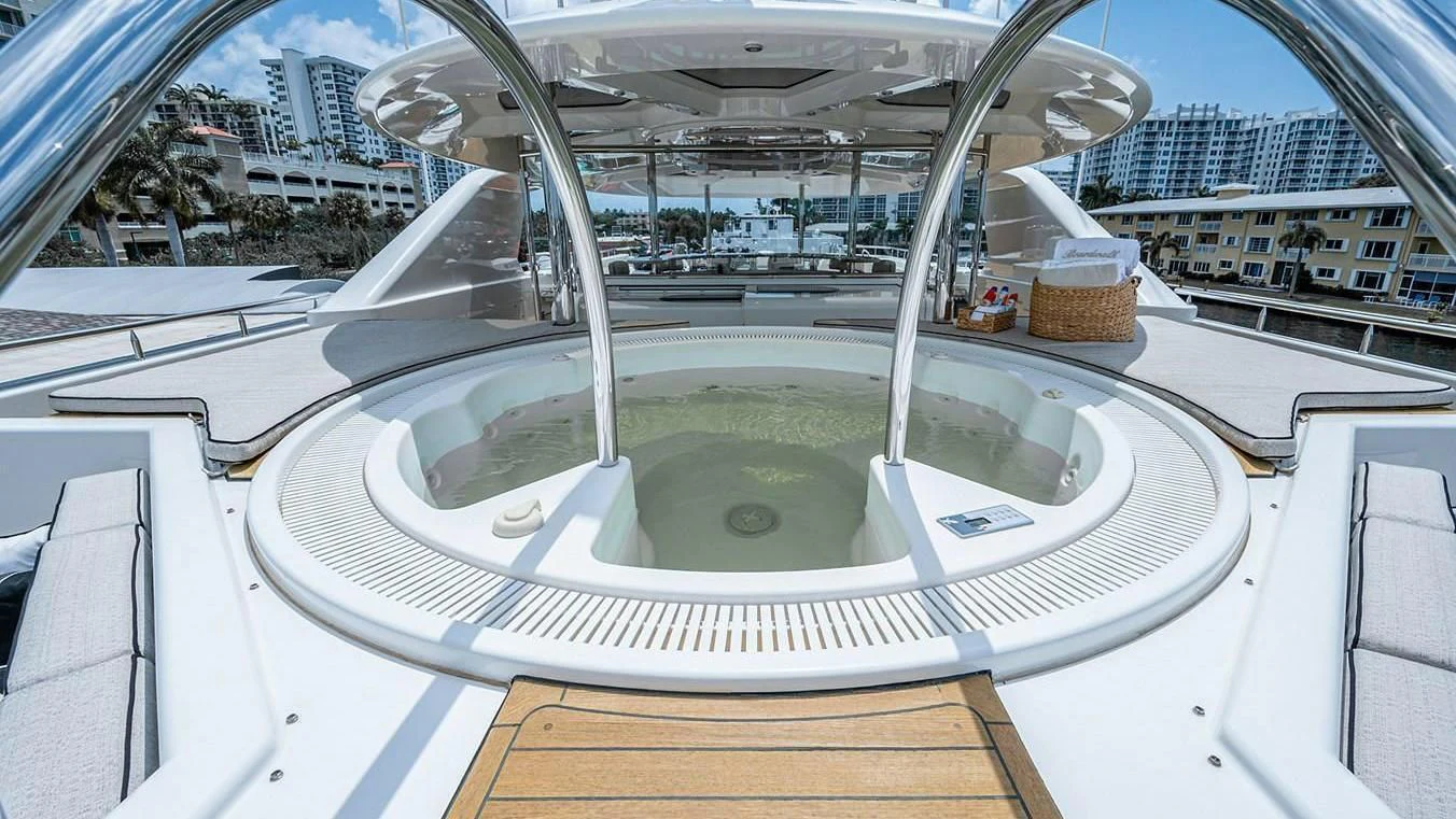 a glass building with a pool aboard NIGHT HOWL Yacht for Sale