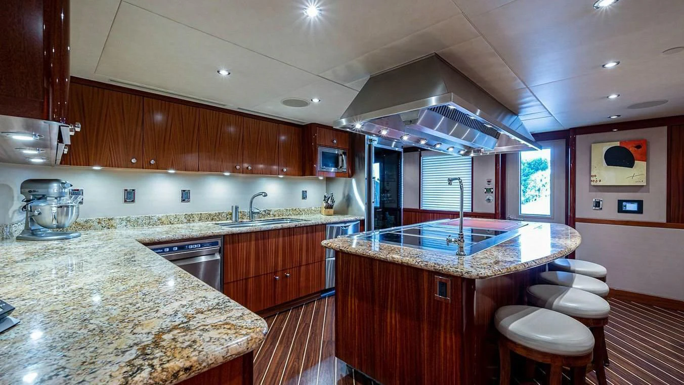 a kitchen with a marble counter top aboard NIGHT HOWL Yacht for Sale