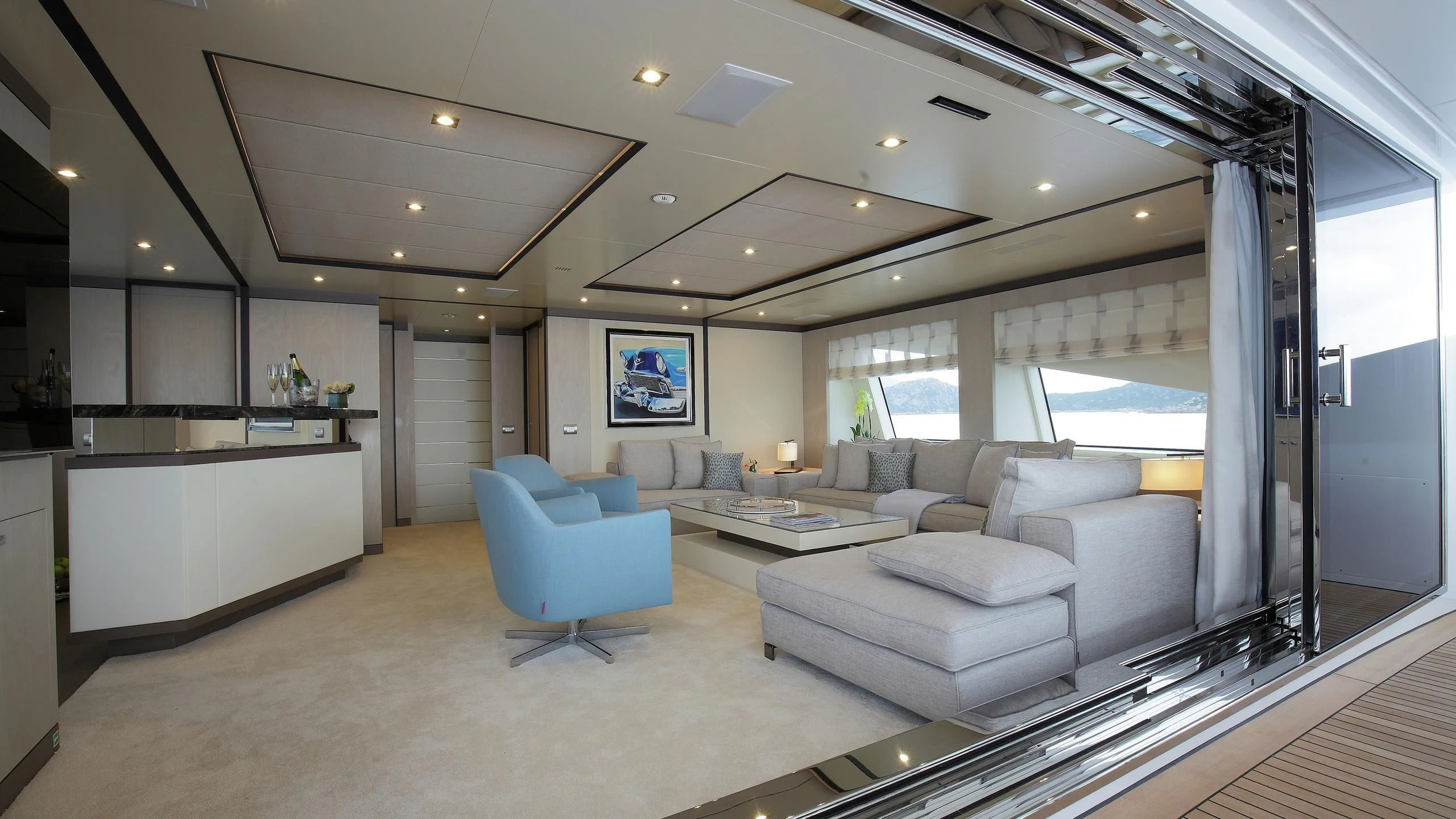 a large living room with a large window aboard WILLOW Yacht for Charter