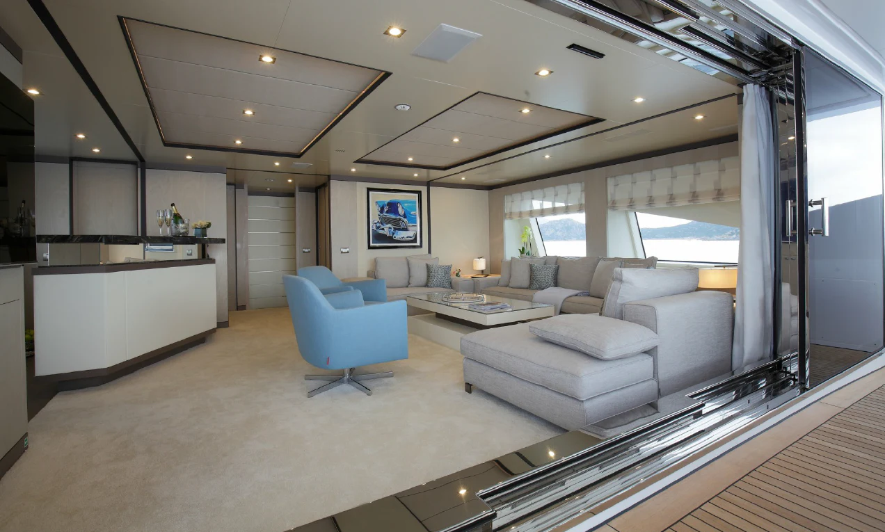 a living room with a large window aboard WILLOW Yacht for Charter