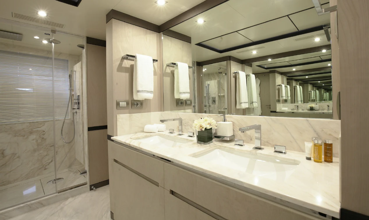 a bathroom with a large mirror aboard WILLOW Yacht for Charter