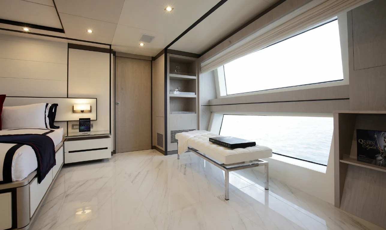 a room with a bed and a desk aboard WILLOW Yacht for Charter