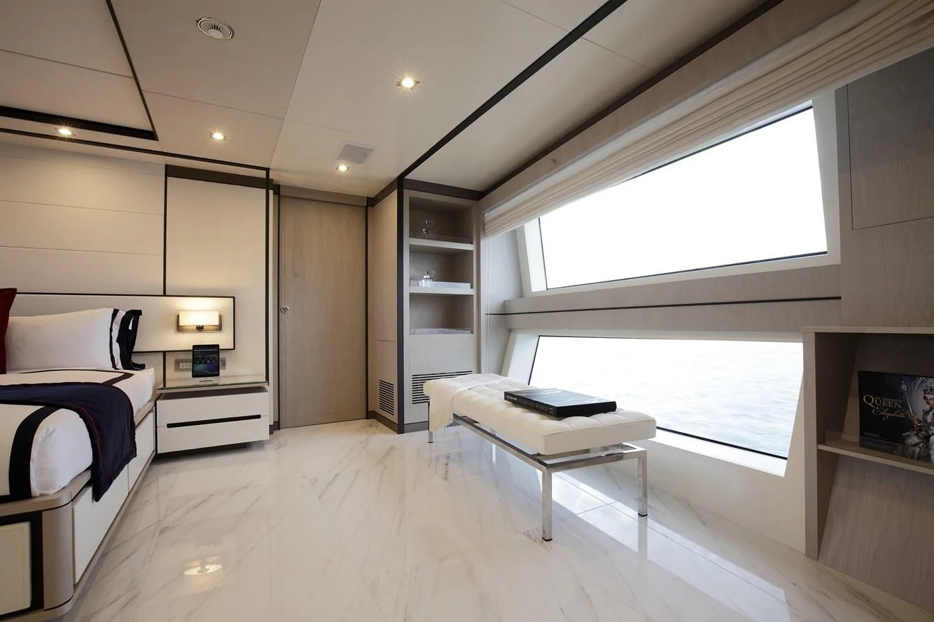 a room with a bed and a desk aboard WILLOW Yacht for Charter