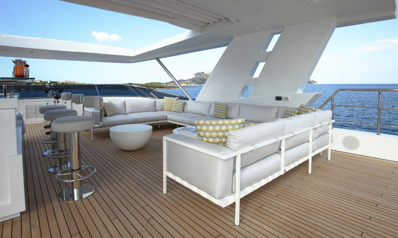 a white couch on a deck aboard WILLOW Yacht for Charter