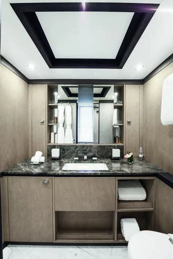 a bathroom with a sink and a mirror aboard WILLOW Yacht for Charter