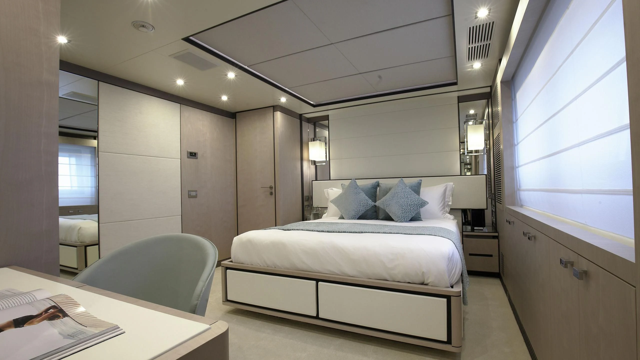 a room with a bed and a desk aboard WILLOW Yacht for Charter