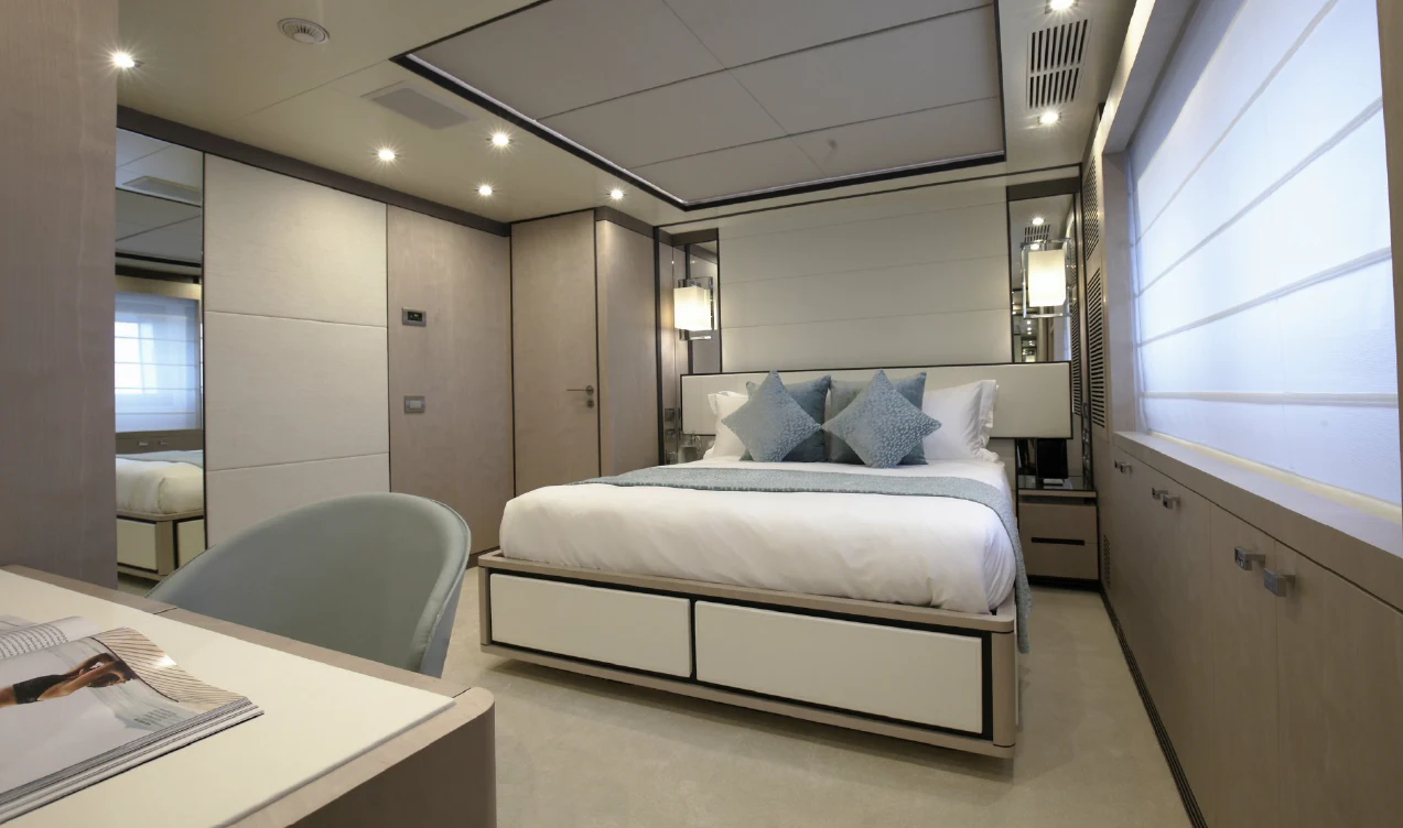 a room with a bed and a desk aboard WILLOW Yacht for Charter