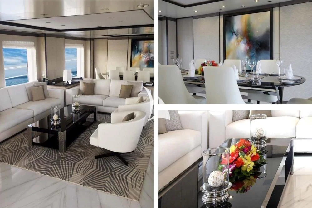 a living room with white couches and a table aboard WILLOW Yacht for Charter