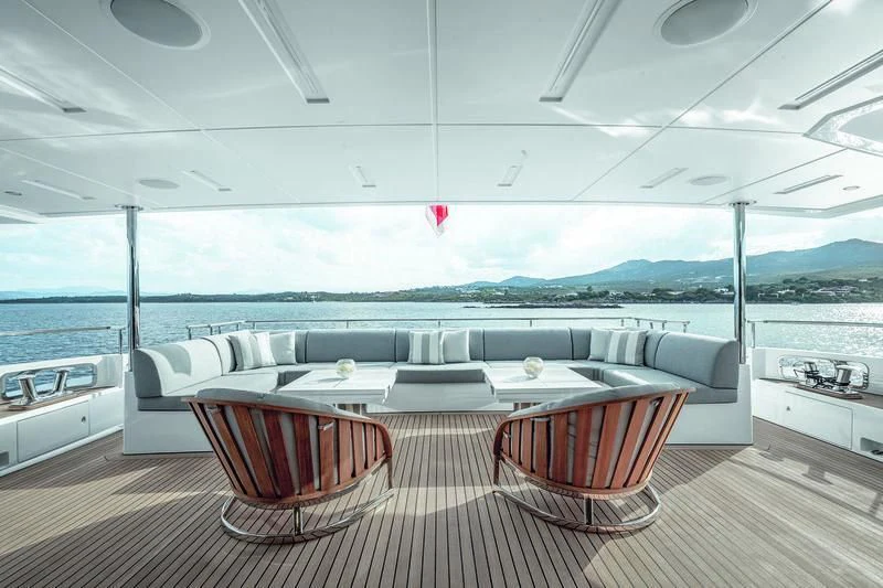 a room with a table and chairs aboard WILLOW Yacht for Charter