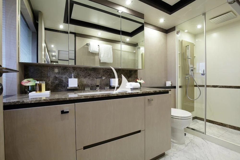 a bathroom with a large mirror aboard WILLOW Yacht for Charter