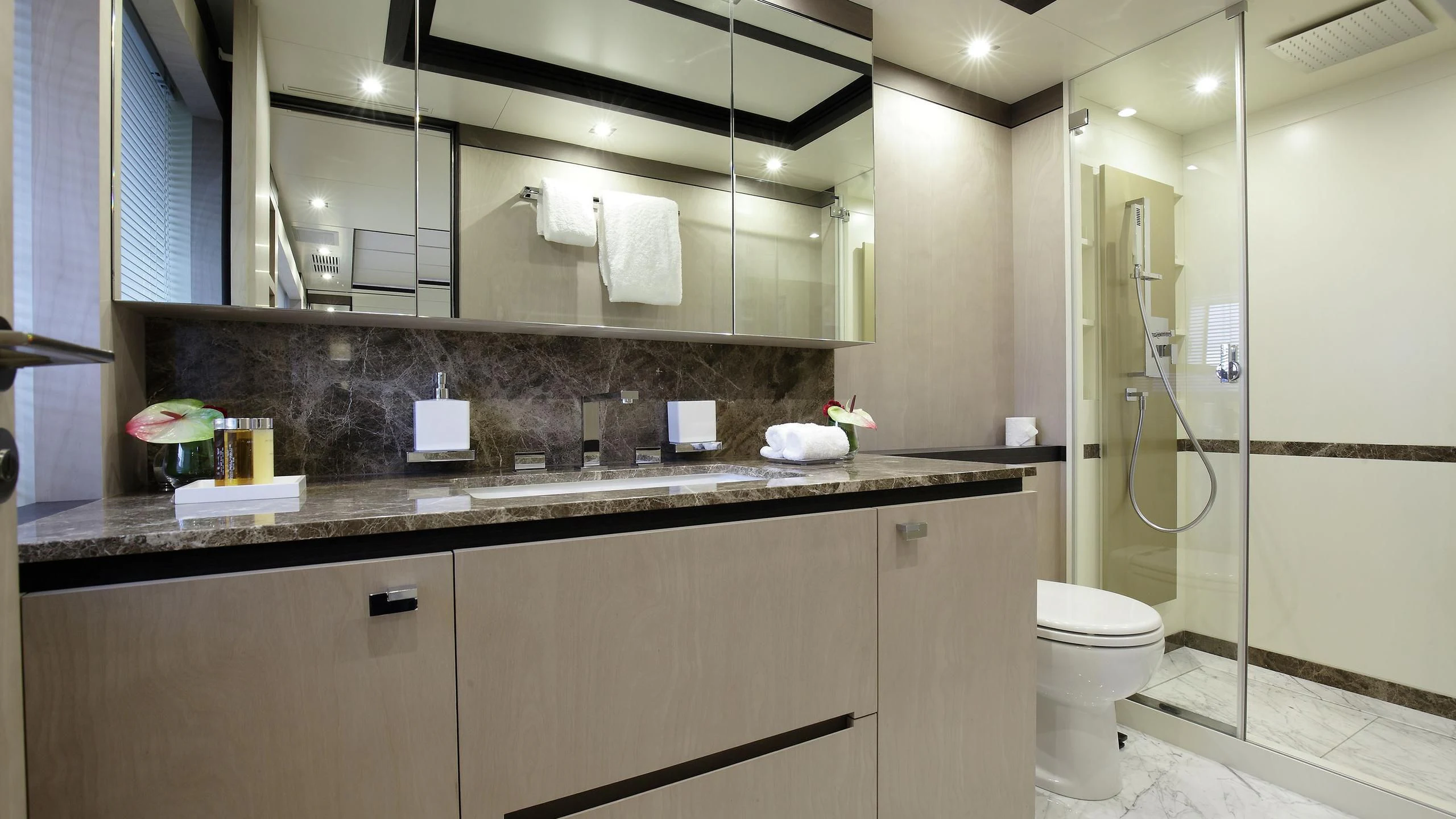 a bathroom with a glass shower aboard WILLOW Yacht for Charter