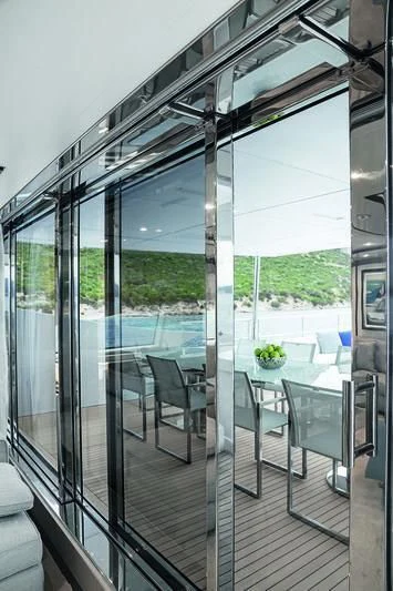 a glass wall with glass doors aboard WILLOW Yacht for Charter