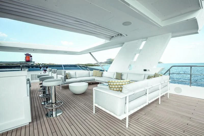 a white couch in a room aboard WILLOW Yacht for Charter