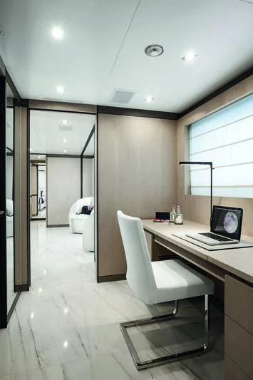 a white office with a white chair aboard WILLOW Yacht for Charter
