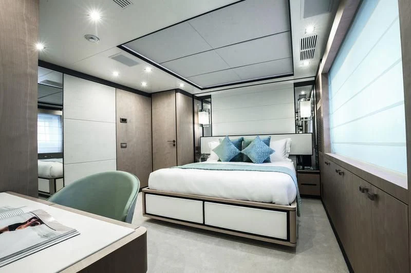 a room with a bed and a desk aboard WILLOW Yacht for Charter