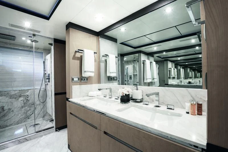 a bathroom with a large mirror aboard WILLOW Yacht for Charter