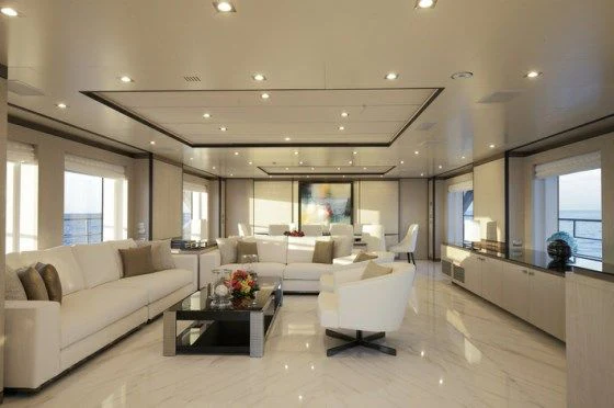 a living room with white furniture aboard WILLOW Yacht for Charter