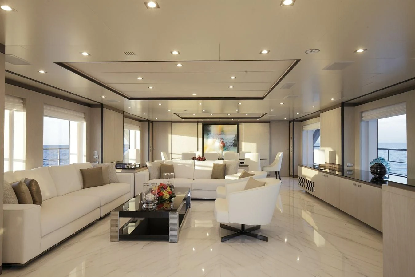 a living room with white furniture aboard WILLOW Yacht for Charter