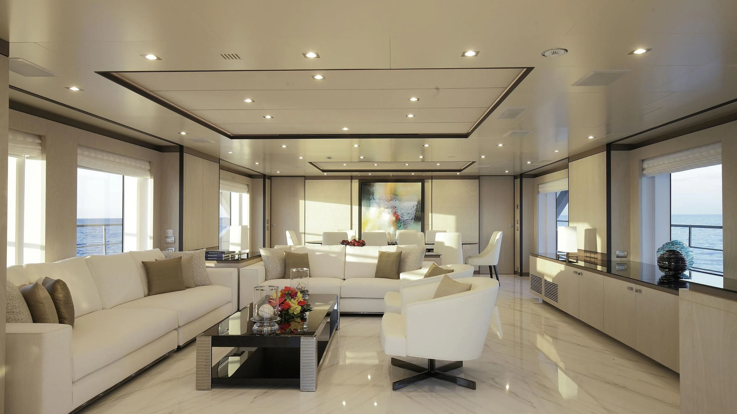 a living room with white furniture aboard WILLOW Yacht for Charter