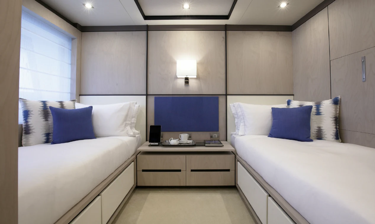 a room with a bed and a desk aboard WILLOW Yacht for Charter