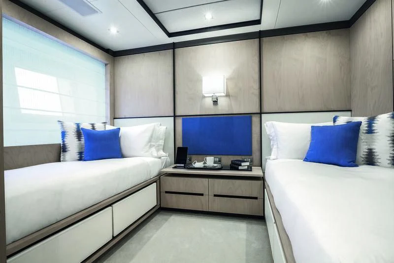 a room with a bed and a tv aboard WILLOW Yacht for Charter