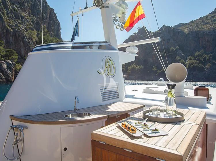 a boat on a table aboard HEAVENLY DAZE Yacht for Sale