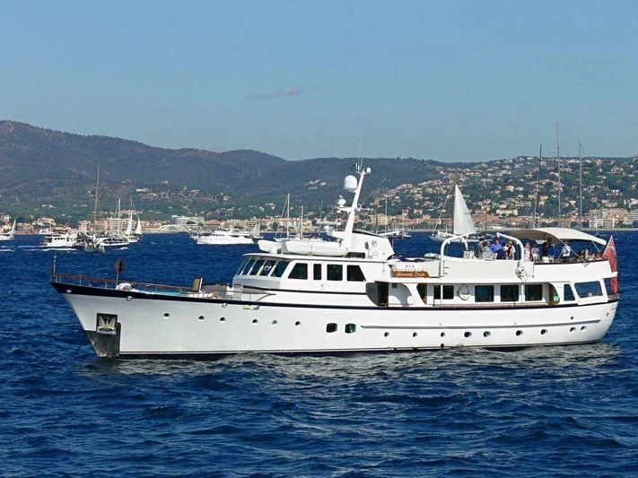 a large white boat in the water aboard HEAVENLY DAZE Yacht for Sale