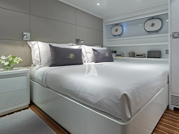 a white bed with a white pillow aboard HEAVENLY DAZE Yacht for Sale