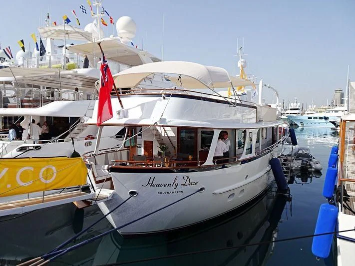 a boat with flags on it aboard HEAVENLY DAZE Yacht for Sale
