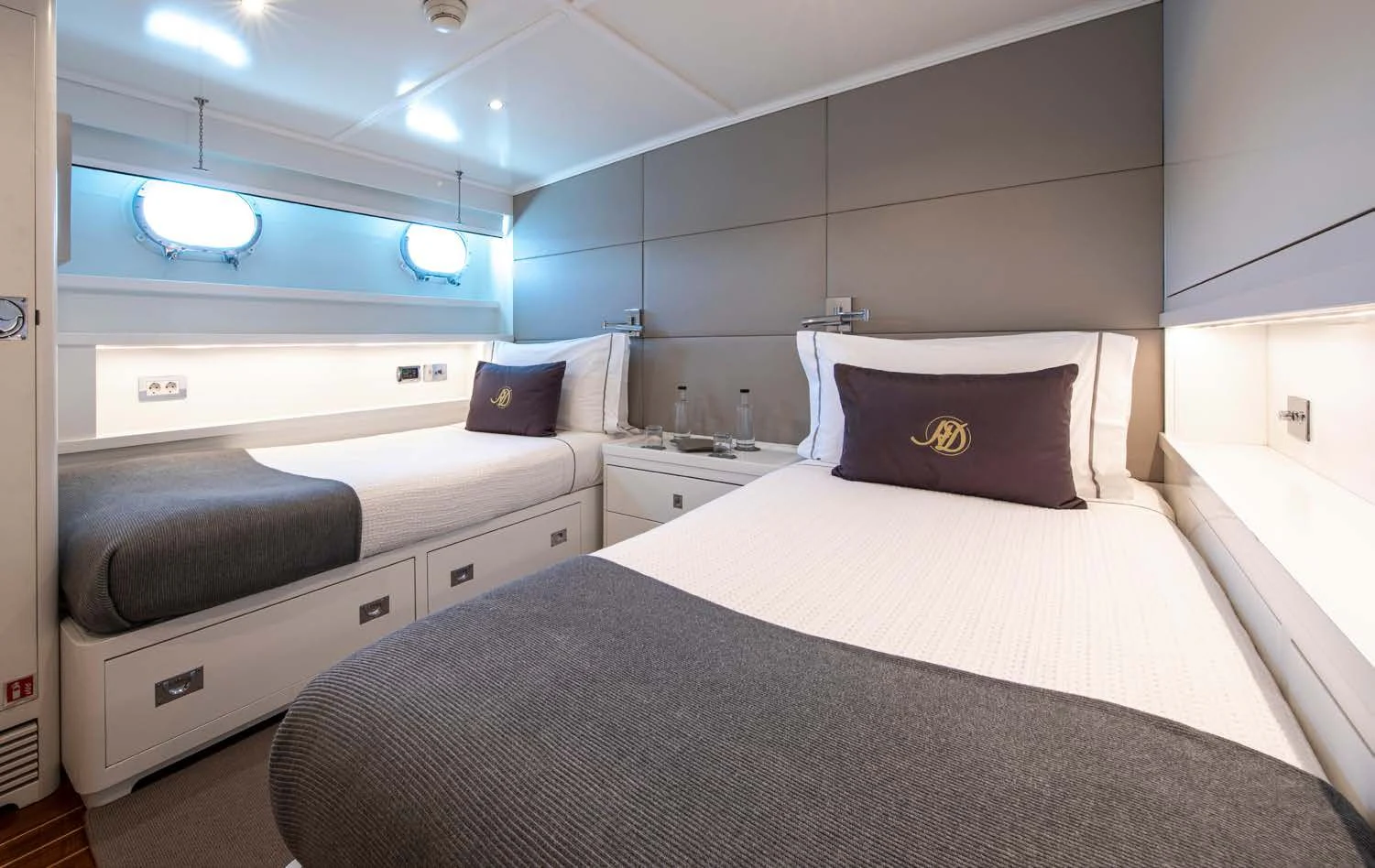 a room with a bed and a desk aboard HEAVENLY DAZE Yacht for Sale
