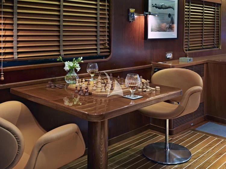a table with wine glasses on it aboard HEAVENLY DAZE Yacht for Sale